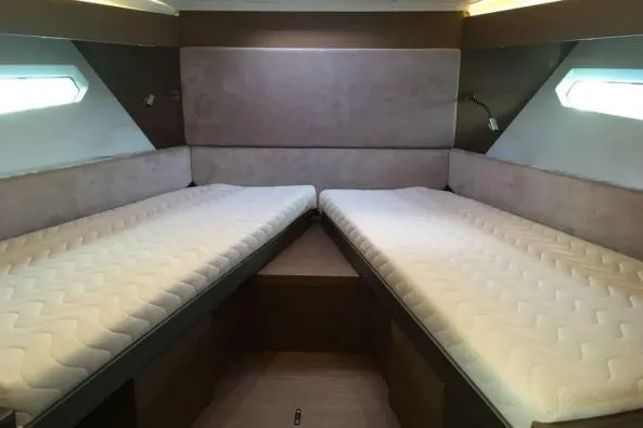 Sol Y Luna Yacht Photos Pics Interior cabin of 2018 Beneteau 46 yacht with twin beds and modern design.
