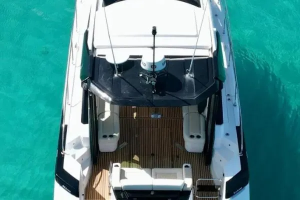 Sol Y Luna Yacht Photos Pics Aerial view of 2018 Beneteau 46 yacht on turquoise water.