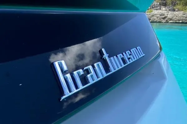 Sol Y Luna Yacht Photos Pics Beneteau 46 Gran Turismo 2018 yacht with reflective logo on sleek black surface.