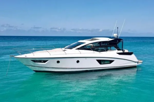 Sol Y Luna Yacht Photos Pics 2018 Beneteau 46 yacht on clear turquoise water under a blue sky.