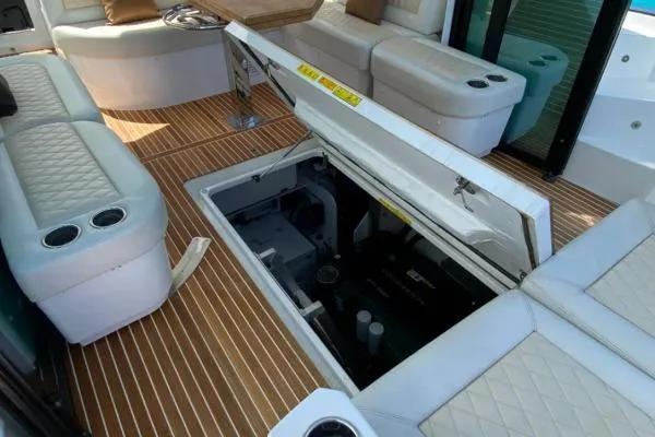 Sol Y Luna Yacht Photos Pics Luxurious 2018 Beneteau 46 yacht interior with open engine compartment and plush seating.