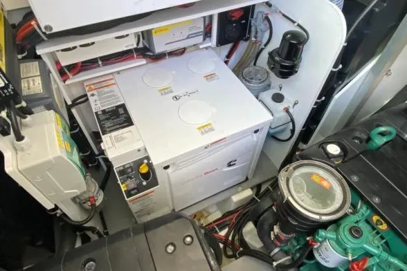 Sol Y Luna Yacht Photos Pics Engine room of a 2018 Beneteau 46 yacht, featuring a Cummins generator.