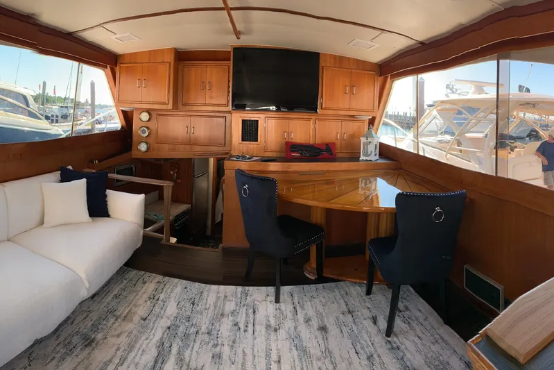  Yacht Photos Pics Luxurious interior of a 1985 Post 43 Convertible yacht with elegant wood finishes.