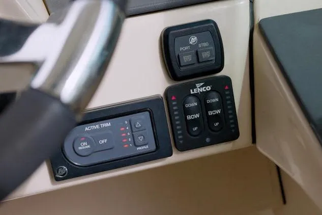 Yacht Photos Pics Control panel of 2021 Boston Whaler 320 Vantage boat, featuring Lenco trim tabs.