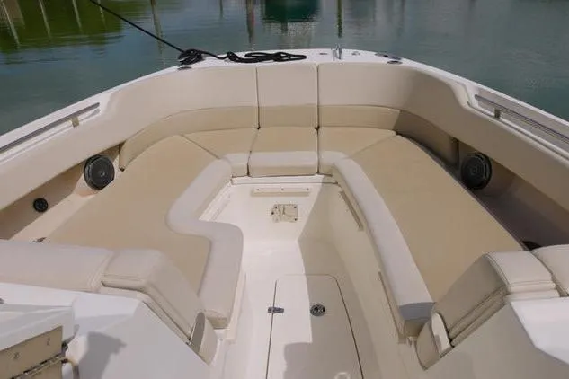  Yacht Photos Pics 2021 Boston Whaler 320 Vantage boat with spacious seating area and beige cushions.