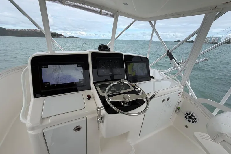  Yacht Photos Pics Helm of 2007 Tiara Yachts 3900 Convertible with navigation screens and steering wheel.