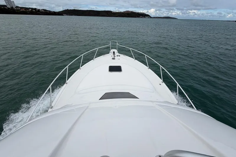  Yacht Photos Pics 2007 Tiara Yachts 3900 Convertible cruising on open water, view from the bow.