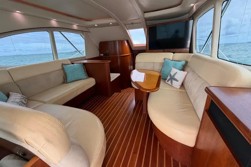  Yacht Photos Pics Luxurious interior of 2007 Tiara Yachts 3900 Convertible with plush seating and ocean view.