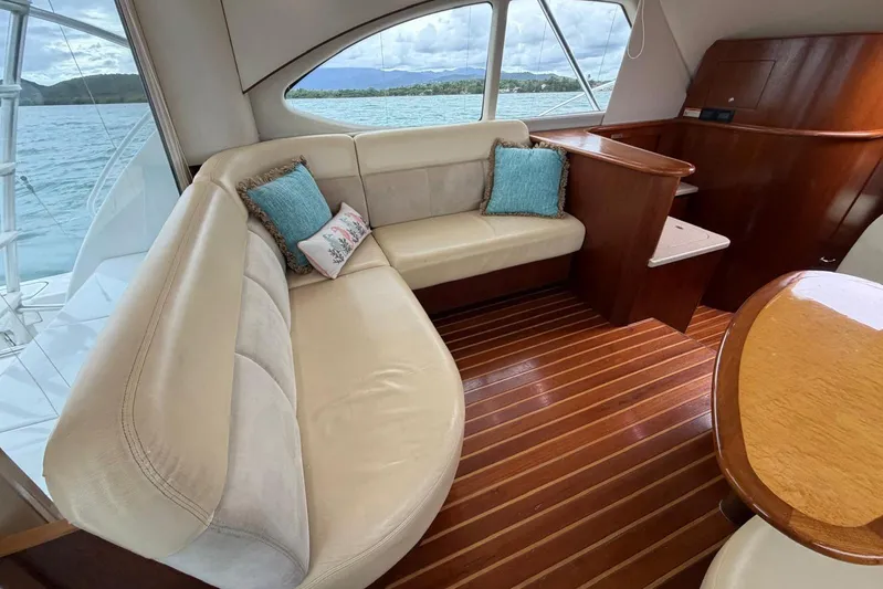  Yacht Photos Pics Luxurious interior of 2007 Tiara Yachts 3900 Convertible with plush seating and wooden flooring.