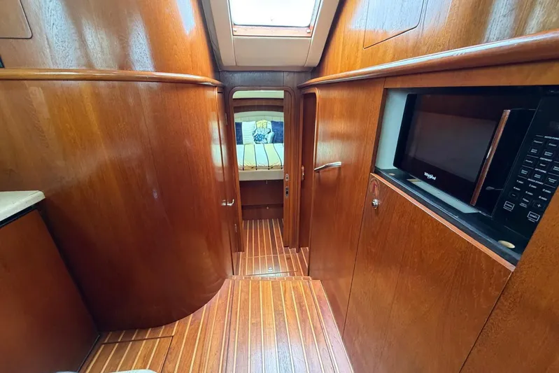  Yacht Photos Pics Interior of 2007 Tiara Yachts 3900 Convertible with wood paneling and modern amenities.