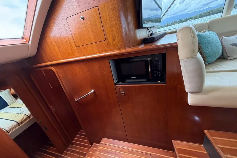  Yacht Photos Pics 2007 Tiara Yachts 3900 Convertible interior with wood cabinetry and built-in microwave.