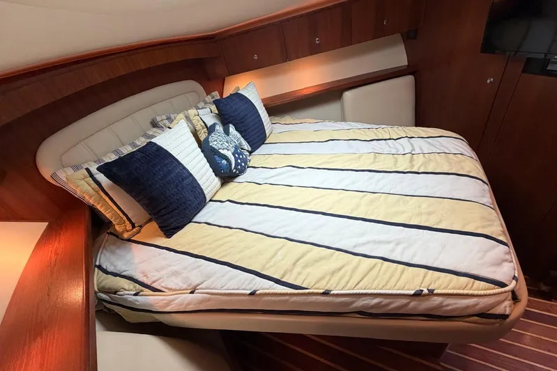  Yacht Photos Pics Luxurious cabin interior of 2007 Tiara Yachts 3900 Convertible with cozy bedding.