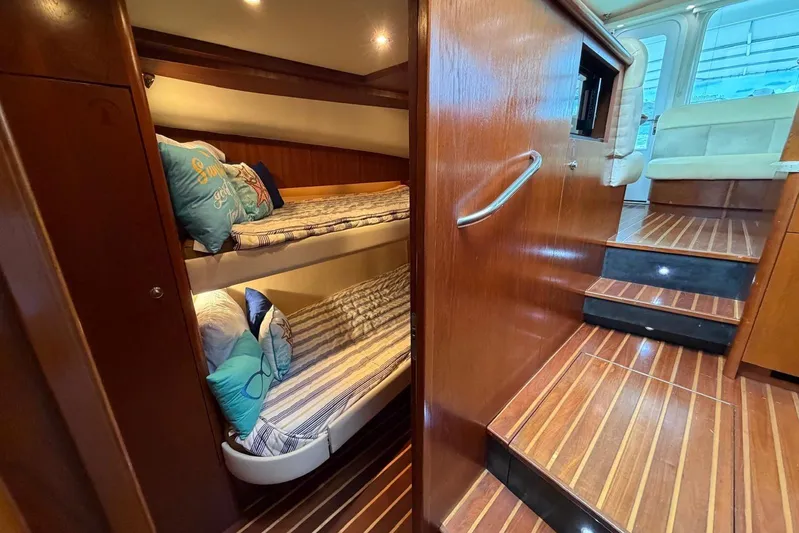  Yacht Photos Pics 2007 Tiara Yachts 3900 Convertible interior with bunk beds and wooden flooring.