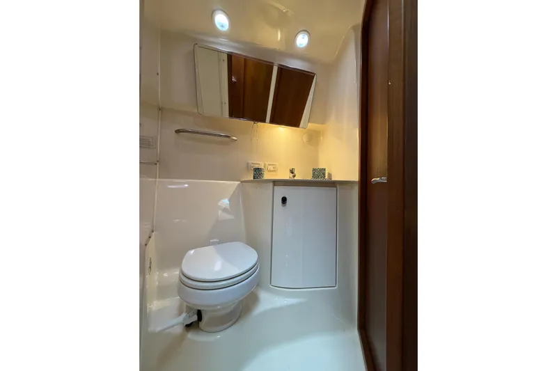  Yacht Photos Pics Luxurious bathroom in 2007 Tiara Yachts 3900 Convertible, featuring modern fixtures and elegant design.