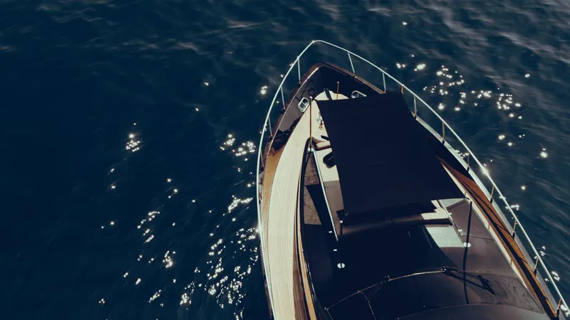 Black Rock Yacht Photos Pics Aerial view of Custom 77 yacht on sparkling blue water, 2008 model.