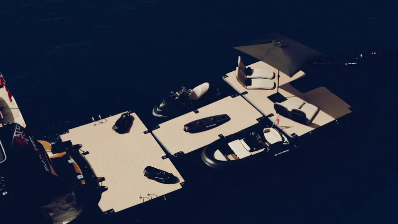 Black Rock Yacht Photos Pics Floating dock with jet skis and lounge chairs, Custom 77 model, 2008.