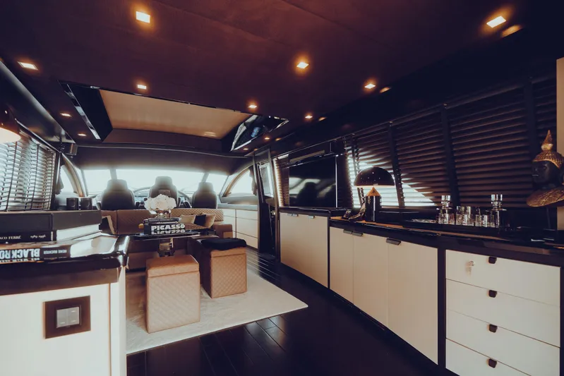 Black Rock Yacht Photos Pics Luxurious interior of a 2008 Custom 77 yacht with modern furnishings and ambient lighting.