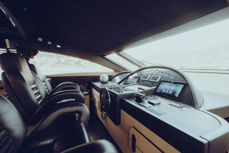 Black Rock Yacht Photos Pics Luxurious yacht cockpit interior with leather seats and advanced navigation controls, Custom 77 model, 2008.