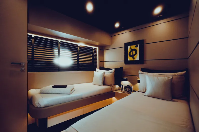 Black Rock Yacht Photos Pics Luxurious yacht cabin with twin beds, modern decor, and ambient lighting, Custom 77 model, 2008.