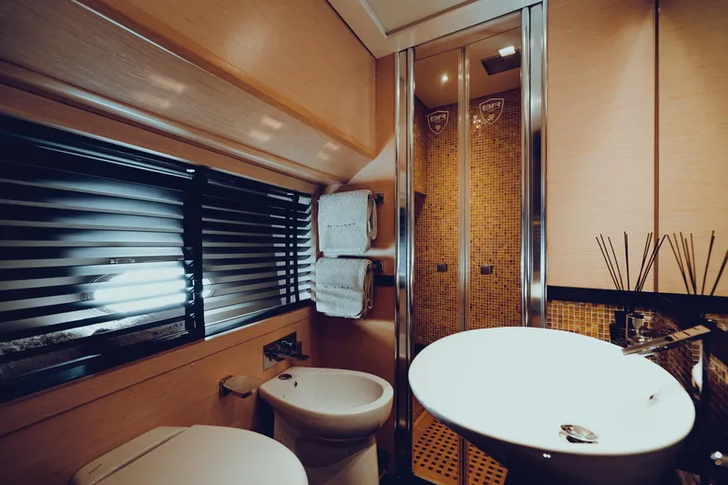 Black Rock Yacht Photos Pics Luxurious yacht bathroom with modern fixtures, glass shower, and elegant decor, Custom 77, 2008.