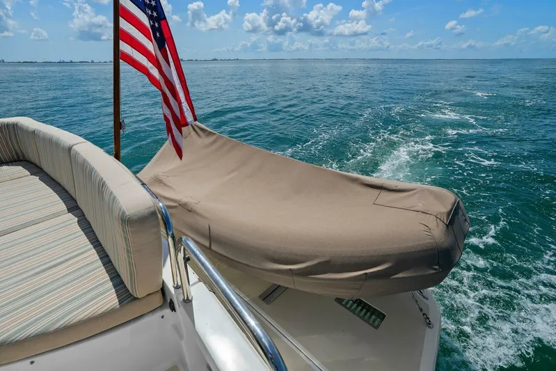 Rowe Boat Yacht Photos Pics 2018 Sabre 48 Salon Express yacht with American flag, cruising on open water.