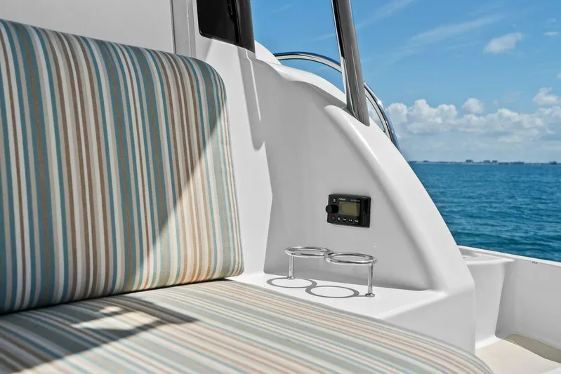 Rowe Boat Yacht Photos Pics Striped seating on 2018 Sabre 48 Salon Express yacht, ocean view in background.