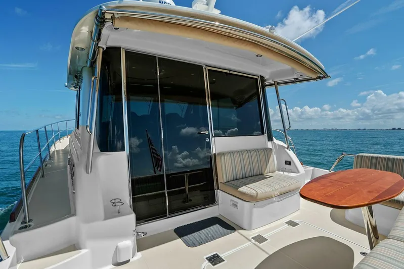 Rowe Boat Yacht Photos Pics 2018 Sabre 48 Salon Express yacht with outdoor seating and ocean view.