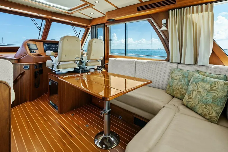 Rowe Boat Yacht Photos Pics Interior of 2018 Sabre 48 Salon Express yacht with elegant seating and ocean view.