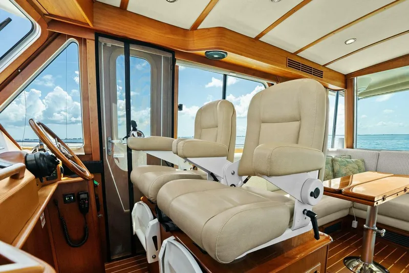 Rowe Boat Yacht Photos Pics Interior of 2018 Sabre 48 Salon Express yacht with plush seating and ocean view.