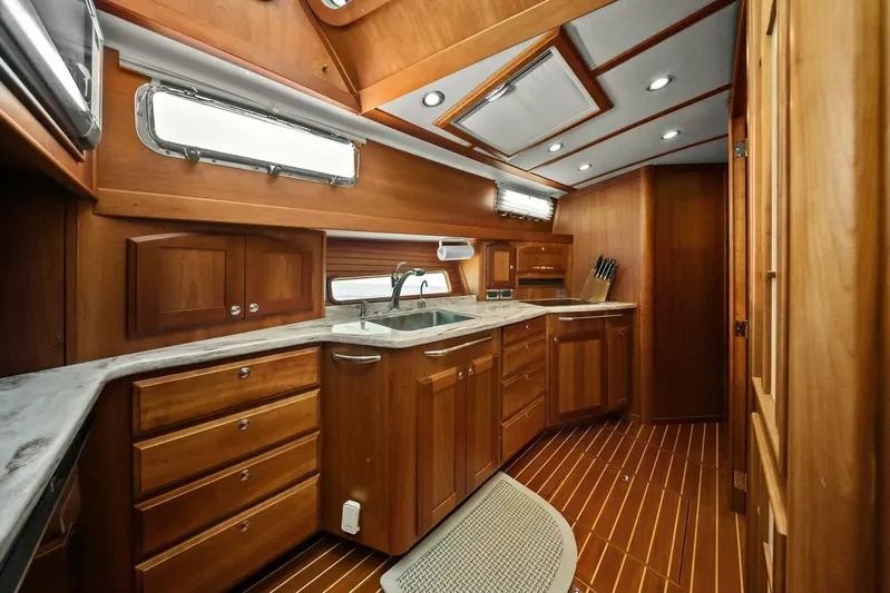 Rowe Boat Yacht Photos Pics Luxurious wooden interior of 2018 Sabre 48 Salon Express yacht kitchen.