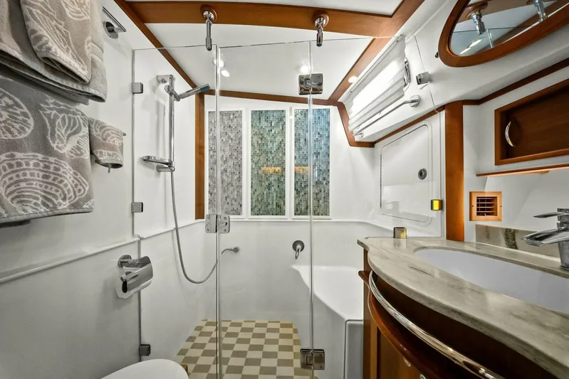 Rowe Boat Yacht Photos Pics Luxurious bathroom in 2018 Sabre 48 Salon Express yacht with modern fixtures and elegant design.