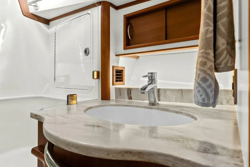 Rowe Boat Yacht Photos Pics Luxurious bathroom interior of 2018 Sabre 48 Salon Express yacht with marble countertop.