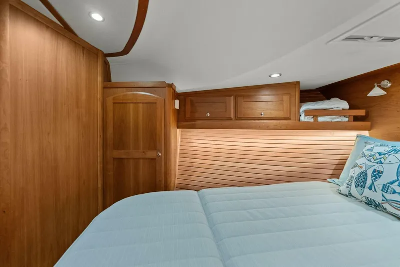 Rowe Boat Yacht Photos Pics Cozy cabin interior of 2018 Sabre 48 Salon Express with wooden finish and nautical decor.