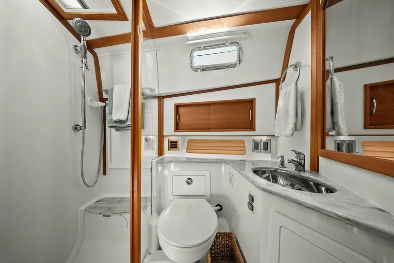 Rowe Boat Yacht Photos Pics Luxurious bathroom in 2018 Sabre 48 Salon Express yacht with modern fixtures and wood accents.