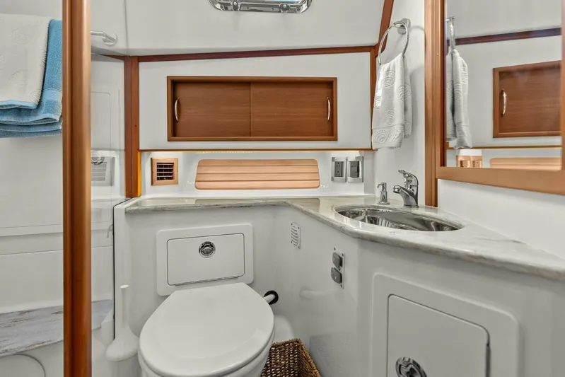 Rowe Boat Yacht Photos Pics Luxurious bathroom in 2018 Sabre 48 Salon Express yacht with modern fixtures and wooden accents.