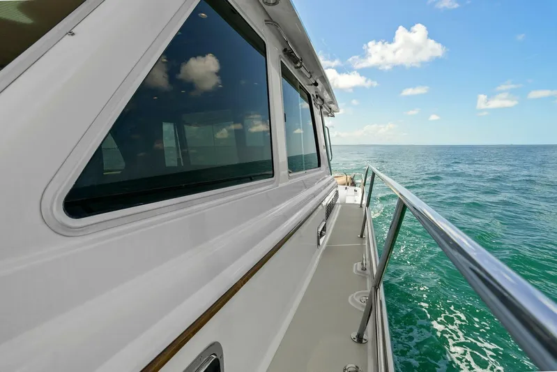 Rowe Boat Yacht Photos Pics 2018 Sabre 48 Salon Express yacht cruising on open sea under blue sky.