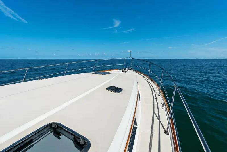Rowe Boat Yacht Photos Pics 2018 Sabre 48 Salon Express yacht deck with ocean view under clear blue sky.