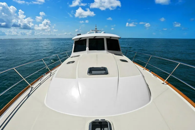 Rowe Boat Yacht Photos Pics 2018 Sabre 48 Salon Express yacht cruising on open sea under blue sky.