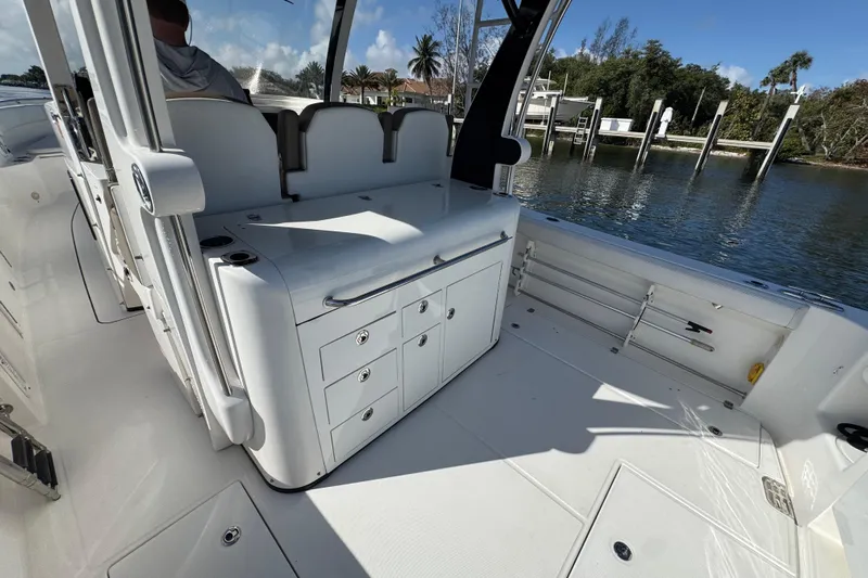  Yacht Photos Pics 2017 Edgewater 368CC boat interior with seating and storage, dockside view.