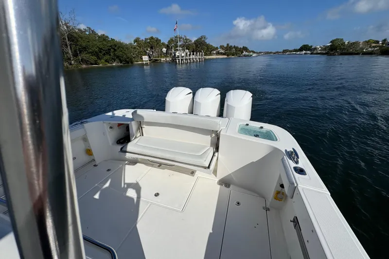  Yacht Photos Pics 2017 Edgewater 368CC boat on calm water, featuring spacious deck and triple engines.