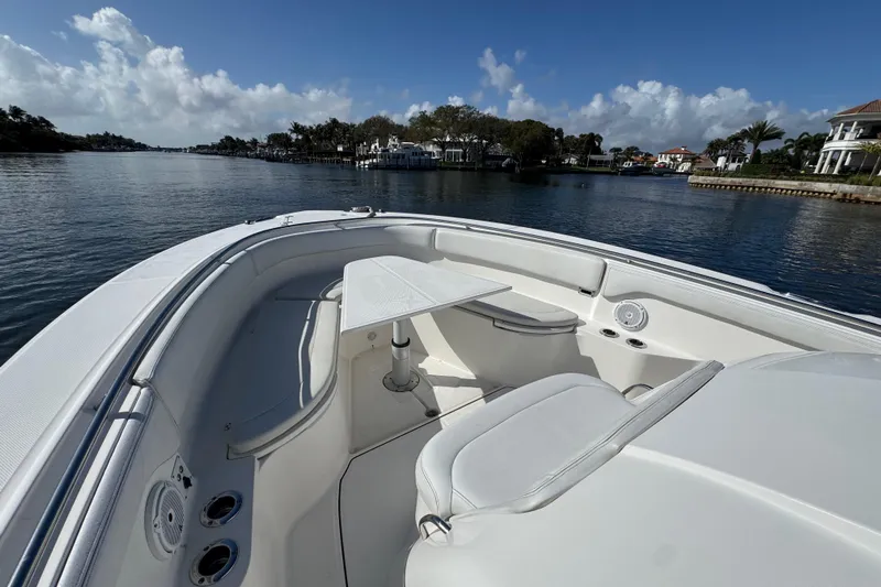  Yacht Photos Pics 2017 Edgewater 368CC boat interior with seating and table on a sunny day.