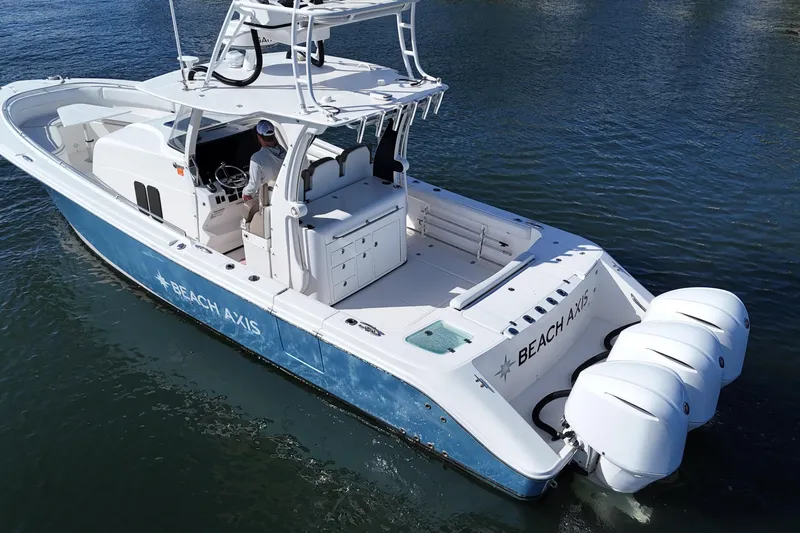  Yacht Photos Pics 2017 Edgewater 368CC boat with triple engines on water, labeled "BEACH AXIS."