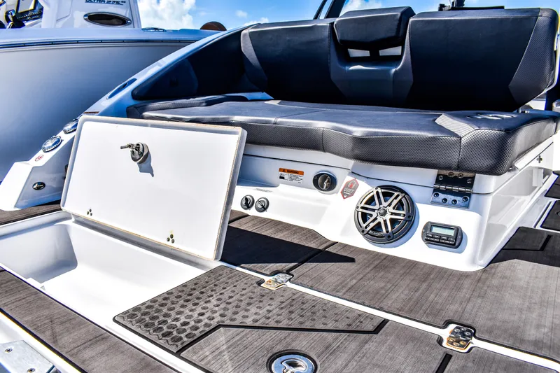  Yacht Photos Pics 2024 Scarab 285 ID boat interior with seating, storage, and audio system.