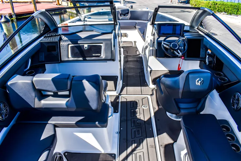 Yacht Photos Pics 2024 Scarab 285 ID boat interior with modern dashboard and seating.