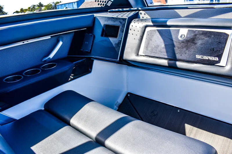  Yacht Photos Pics Interior of 2024 Scarab 285 ID boat, featuring sleek seating and modern design elements.