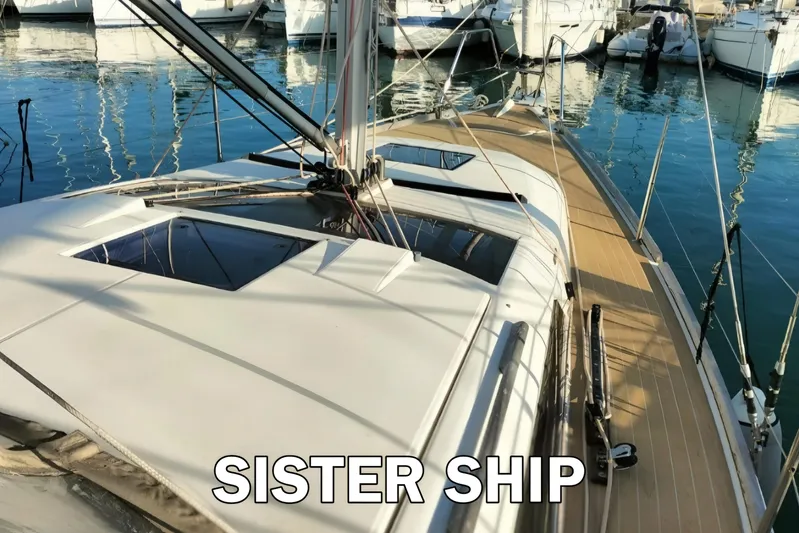  Yacht Photos Pics 2020 Dufour 360 Grand Large sailboat docked in marina, showcasing sleek deck design.