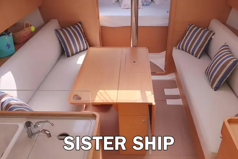  Yacht Photos Pics Interior of 2020 Dufour 360 Grand Large yacht with cozy seating and striped cushions.