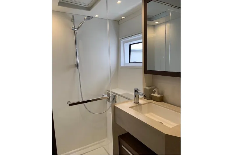  Yacht Photos Pics Modern bathroom in 2020 Lagoon 46 yacht with sleek shower and vanity.