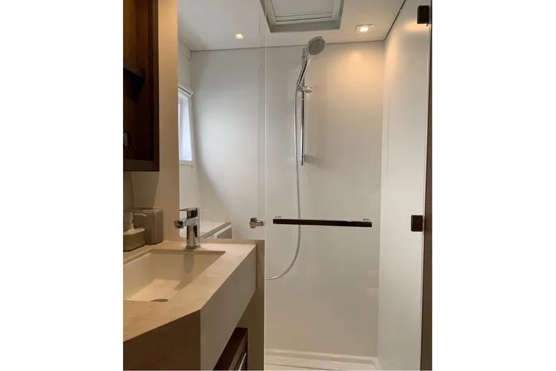  Yacht Photos Pics Modern bathroom in 2020 Lagoon 46 yacht with sleek shower and vanity.