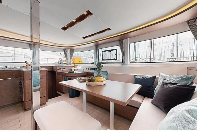  Yacht Photos Pics Interior of 2020 Lagoon 46 catamaran with modern kitchen and dining area.